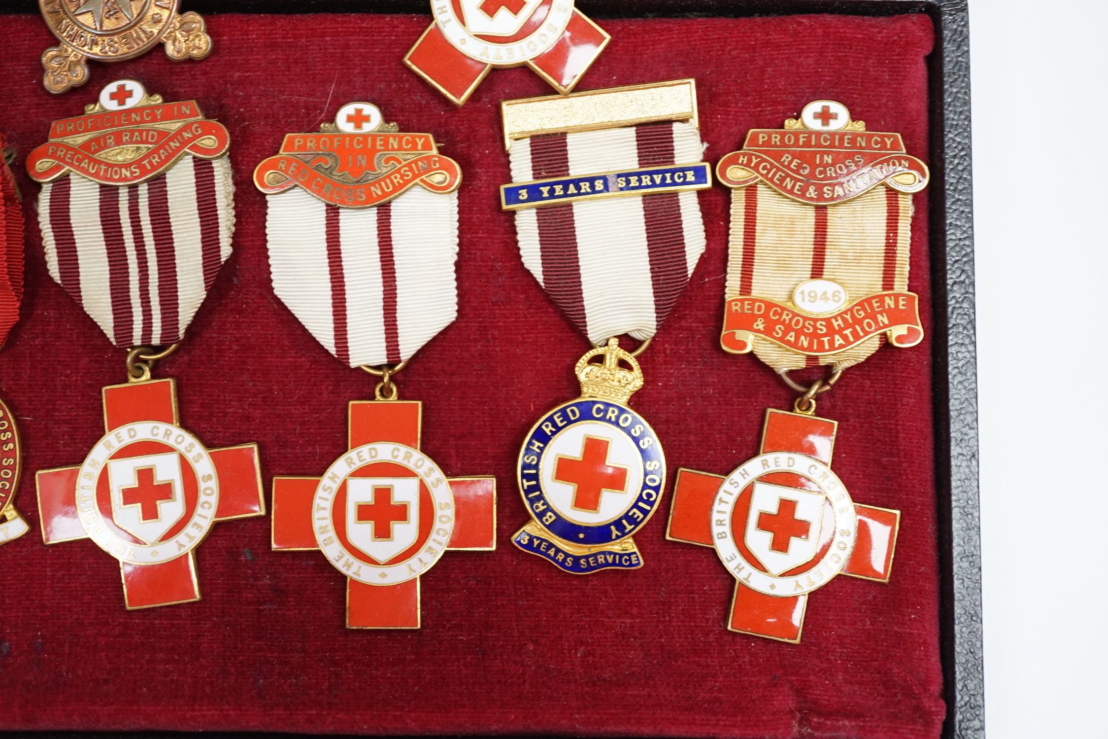 A collection of British Red Cross, etc. medals, awards and memorabilia including medals in original card boxes, a WWII medal group with miniatures including a Voluntary Medical Services Medal, proficiency in first aid me